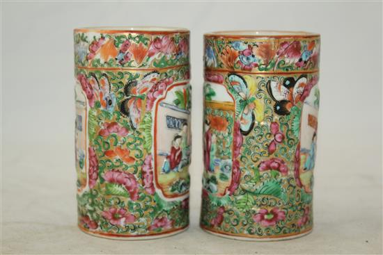 Pair of Chinese famille rose cylindrical brush pots, mid 19th century, 10.5cm., one cracked(-)